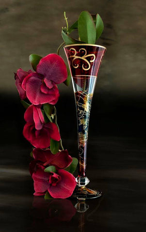 Image of diamond painting of red orchids and a decorative glass