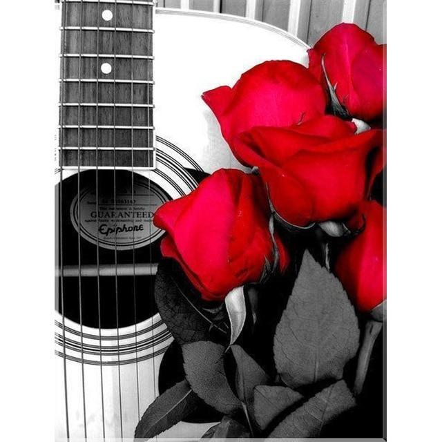 diamond painting of red roses and a guitar