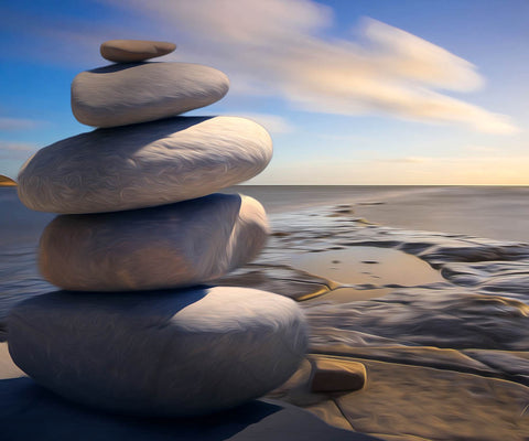 Image of diamond painting of stacked rocks on a beach