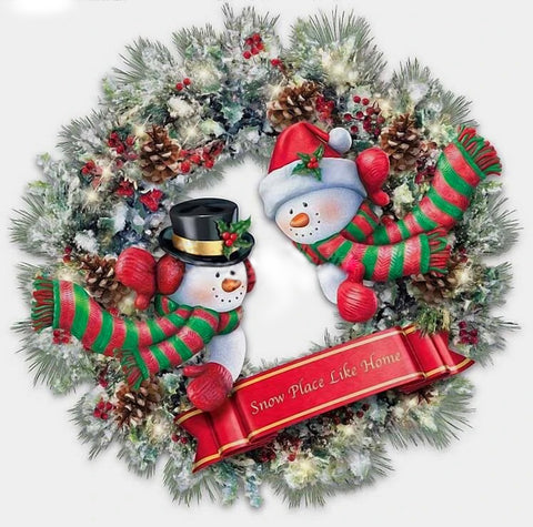 Image of Diamond painting of a festive snowman wreath decorated with holly and pinecones.