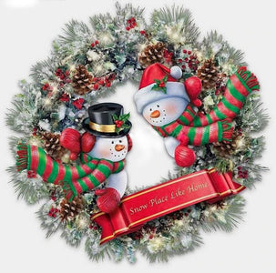 Diamond painting of a festive snowman wreath decorated with holly and pinecones.