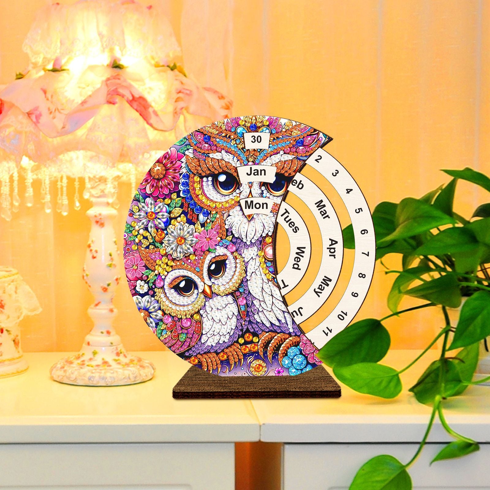 Rotating diamond painting calendar featuring an owl design, wooden base, with month and day indicators, DIY craft for monthly planning