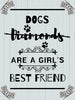 Diamond painting of a quote: "Dogs are a girl's best friend" with paw prints and decorative borders