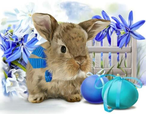 Image of Diamond painting of a cute Easter bunny sitting next to a basket of blue eggs and flowers