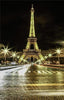 Diamond painting of the Eiffel Tower illuminated at night, with the Seine River and bridge in the foreground