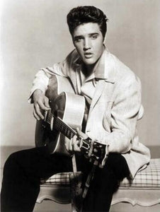 Diamond painting of Elvis Presley rocking a guitar.