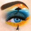 Diamond painting of a creative eye makeup design depicting a sunset, a skydiver, and a sea. It symbolizes faith and hope.