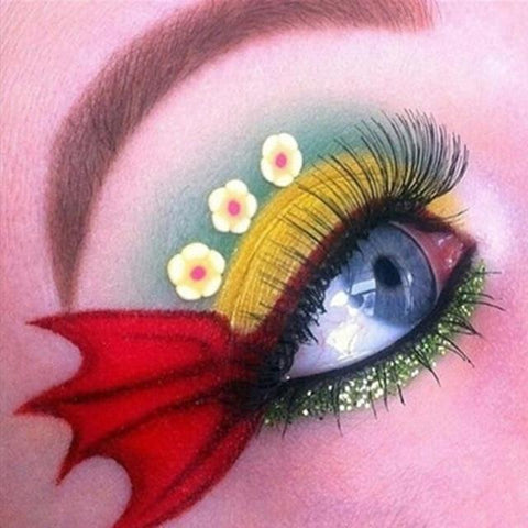 Image of A diamond painting of a creative eye makeup design featuring a fin and flower details.