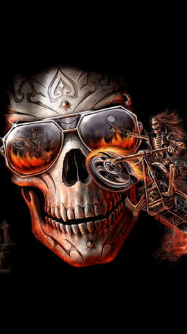 Image of A fiery skull wearing sunglasses with a reflection of a flaming motorcycle and rider, set against a black background.