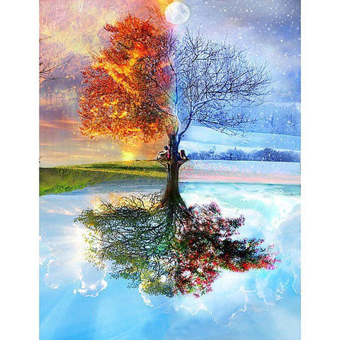 Image of Diamond painting of a tree with four sections depicting each season: spring, summer, autumn, and winter.