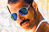 Diamond painting portrait of Freddie Mercury, iconic singer of Queen, wearing his signature glasses. 