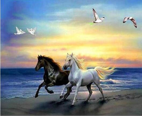 Image of Diamond painting of two brown and white horses running freely along the seashore.
