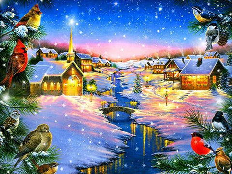 Image of Diamond painting of a winter village scene at night with snow falling, colorful houses with Christmas lights, a decorated Christmas tree, and a church.