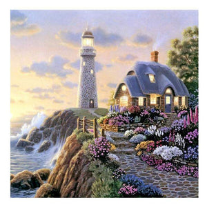 Diamond painting of a lighthouse on a rocky cliff overlooking the ocean