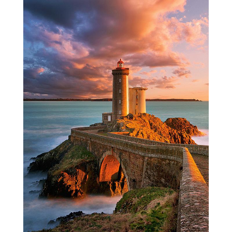 Diamond Painting of a Lighthouse on a Rocky Outcrop at Sunset