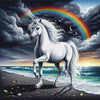 enchanting image of a white unicorn standing on a beach with a rainbow in the sky