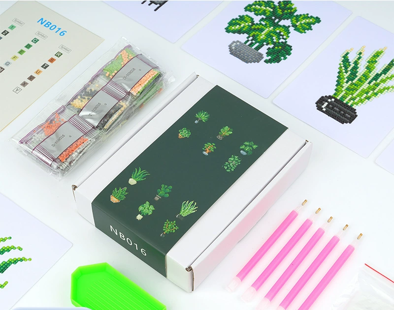 photo showing the contents of a mini diamond painting kit, including diamond drills, tools, canvases, and packaging, highlighting the complete set for DIY crafting