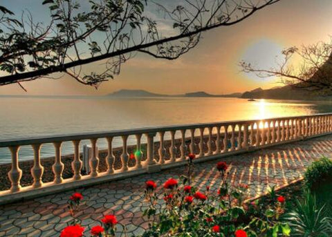 Image of Diamond painting of a beautiful boardwalk overlooking the ocean at sunset