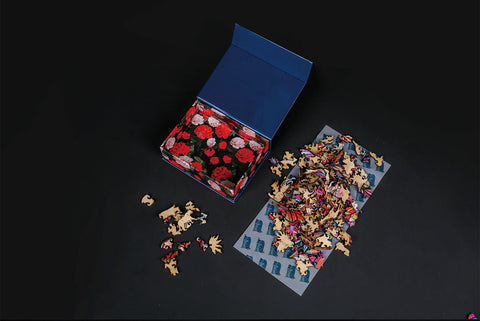 Image of Wooden Jigsaw Puzzle Pieces Spilled from Open Box