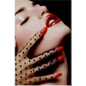 A diamond painting of a woman's face with red lipstick and a gloved hand, creating a glamorous and mysterious look.