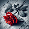 Sparkling diamond art featuring a single, beautiful red rose lying on a background of worn wooden floorboards.