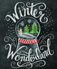 Diamond painting of a snow globe with a winter wonderland scene, including a snowman, pine trees, and falling snow. The text "Winter Wonderland" is written in chalkboard style.