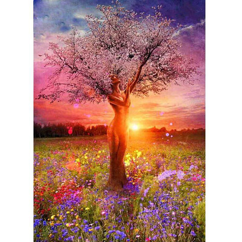 Image of Diamond painting of a womanly tree with blooming flowers and a vibrant sunset