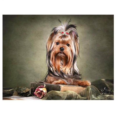 Image of Diamond painting of a Yorkshire Terrier dog sitting on a book with a rose